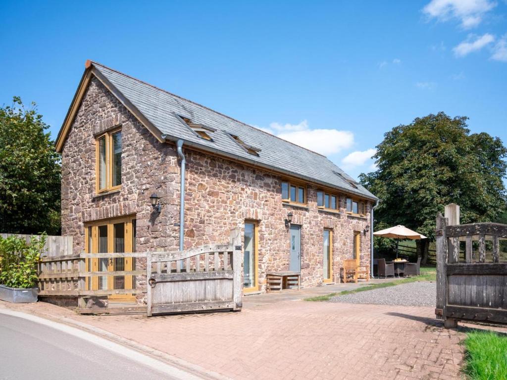 an old stone building on a street at 2 Bed in Crediton oc-72791 in Coldridge