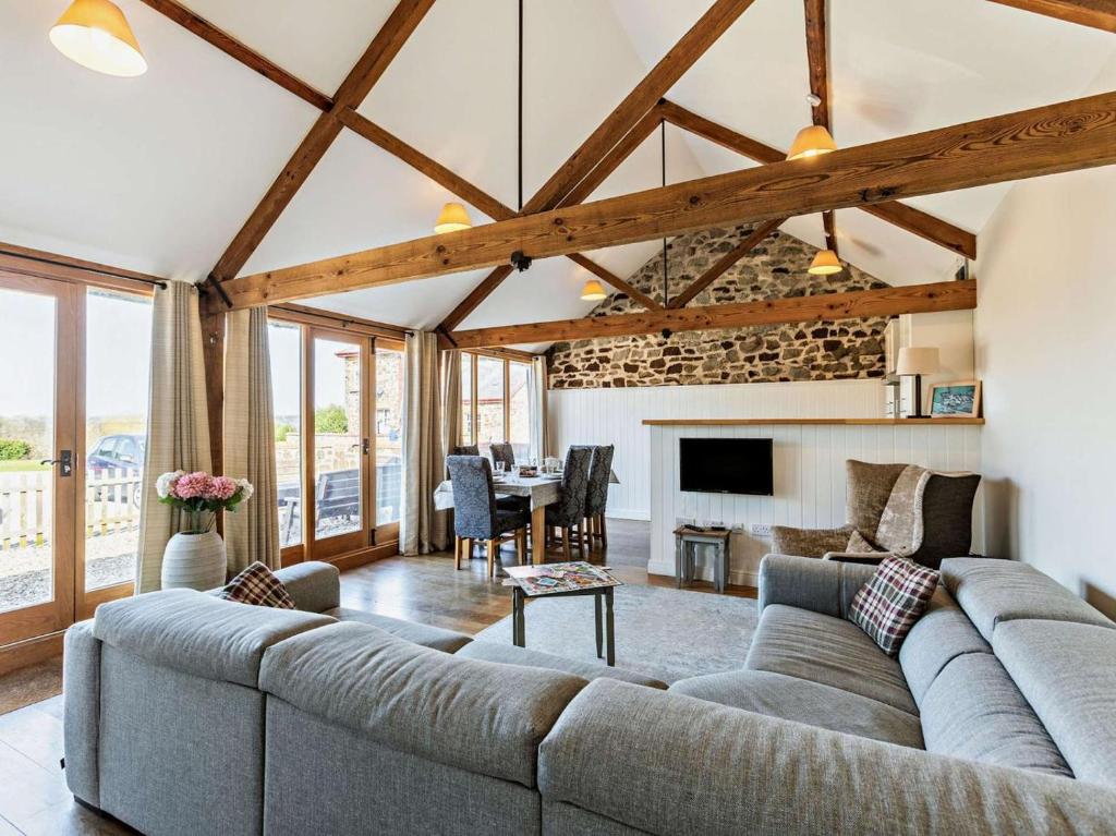 a living room with a couch and a table at 3 Bed in Umberleigh oc-09092 in Umberleigh Bridge