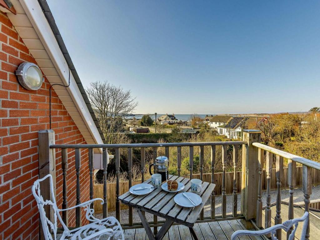 a table and two chairs on a balcony at 1 Bed in Bideford oc-55340 in Instow