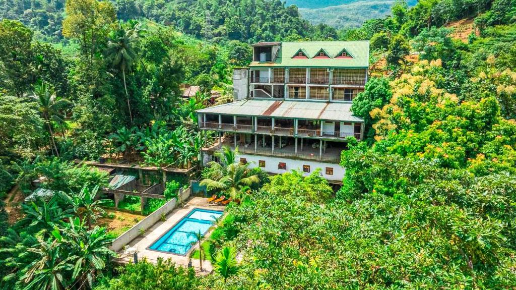 an aerial view of a building in the forest at Kitulgala Ebony Riverside Resort in Kitulgala