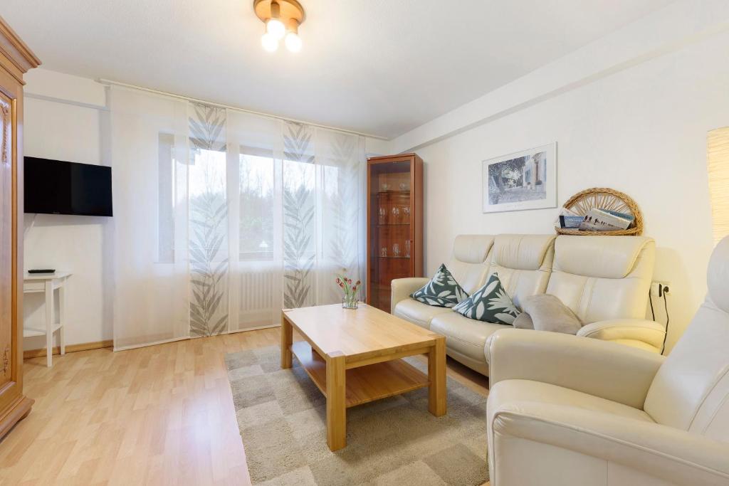 a living room with a couch and a table at Thum in Daisendorf