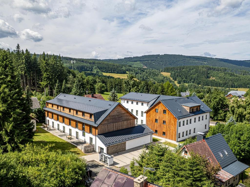 an aerial view of a village with buildings at Apartmán Šumavský skřítek in Čachrov