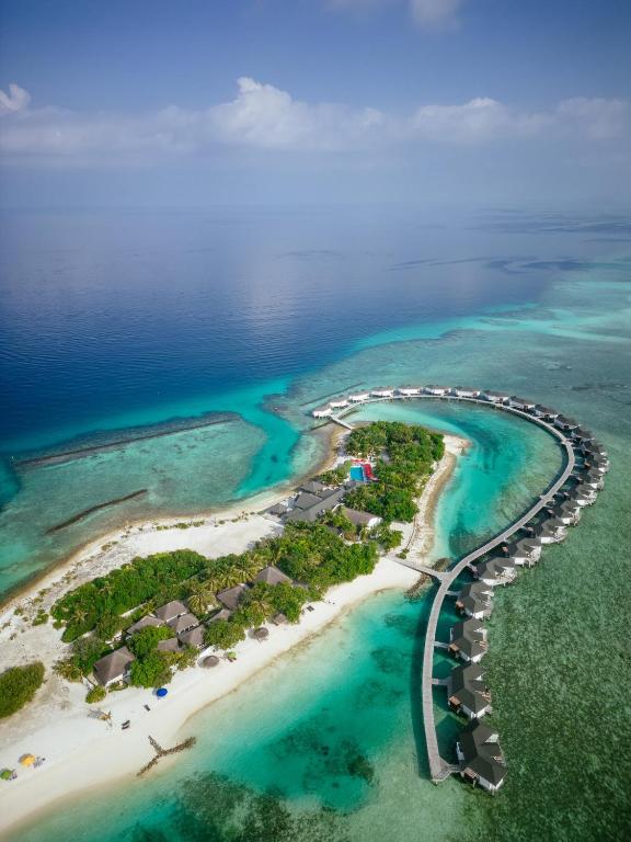 an aerial view of an island in the ocean at Cinnamon Dhonveli Maldives - Complimentary Speedboat Return for 2 pax on 7 nights or more stays valid to 31 Oct 2027 & up to 2 kids stay free in North Male Atoll