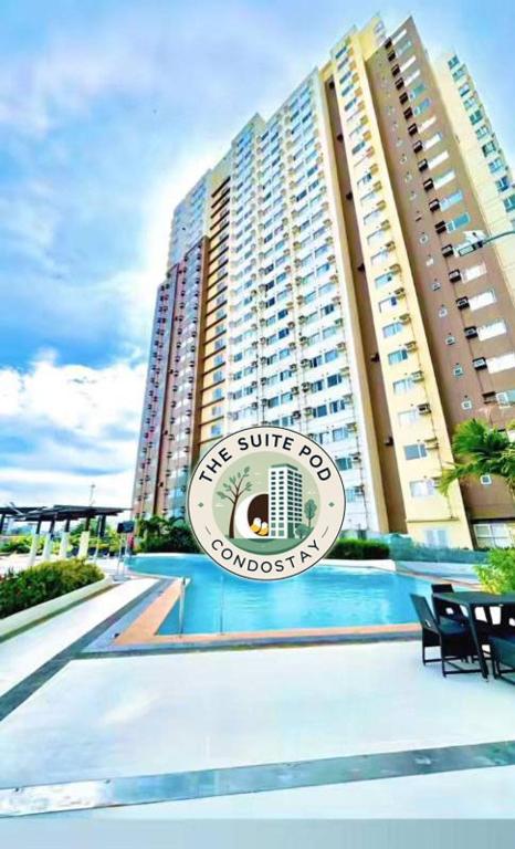 a building with a sign that reads the surf club condominium at The Suite Pod I CDO CondoStaycation - U26 in Cagayan de Oro