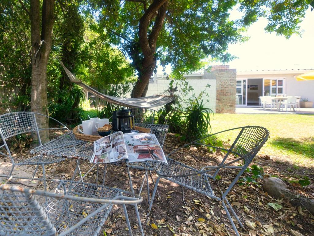 a table with a tea kettle on top of it at 32 Main Road in Struisbaai
