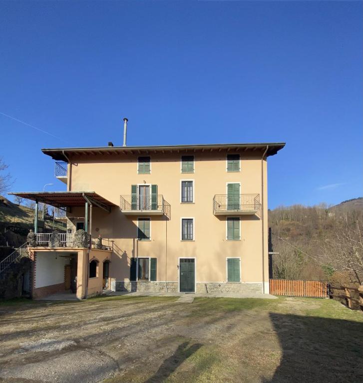 a large building with balconies on the side of it at Appartamento da Mery in Asso