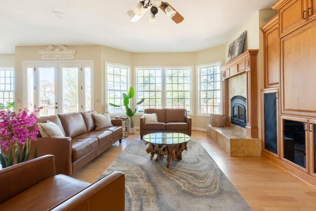 a living room with a couch and a table at Blue Stone Chateau Yosemite Pool Spa Secluded in Abbeyville