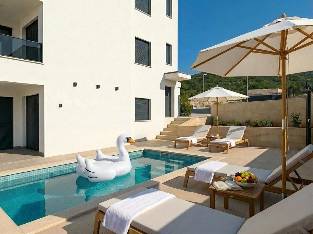 a swimming pool with a swan in a house at Casa Del Mar in Stara Novalja