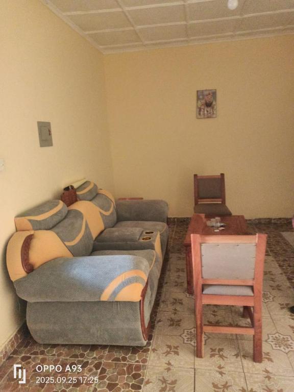 a living room with a couch and a table at Kizi Villas in Watamu