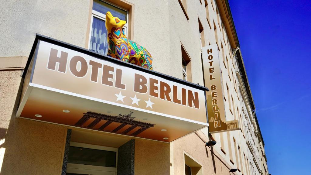 a hotel berlin sign on the side of a building at Hotel Berlin in Leipzig