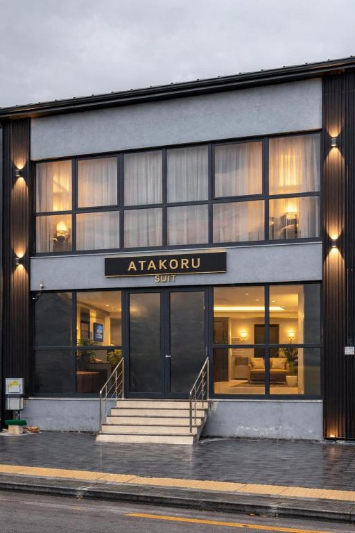 a building with a sign that reads at akariyu at ATAKORU Suit in Alacaatlı