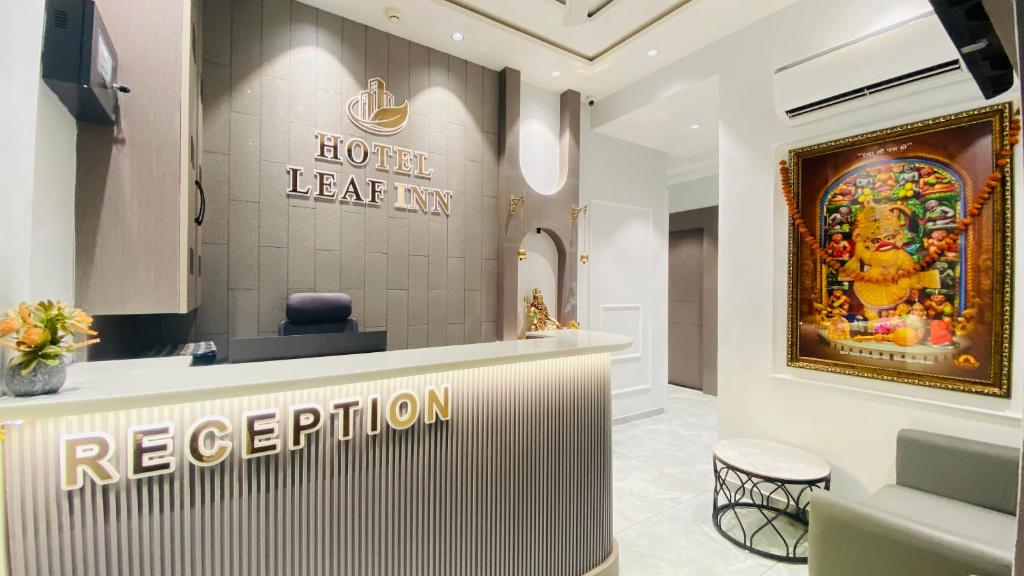 a hair salon with a sign that reads hotel ker inn at Hotel Leaf inn in Ahmedabad