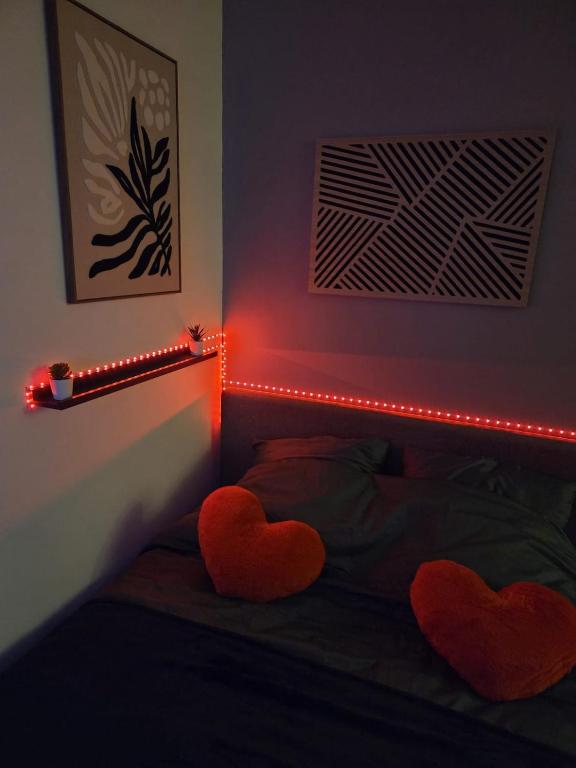 a bedroom with two hearts on the bed with lights at Amour x Paris x Netflix x Wheel chair Access in Ivry-sur-Seine