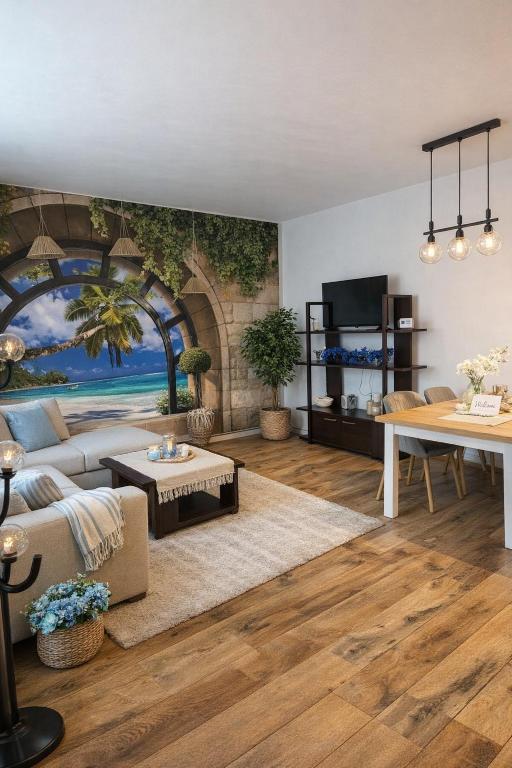 a living room with a painting of a beach at City Tales Residence in Braşov