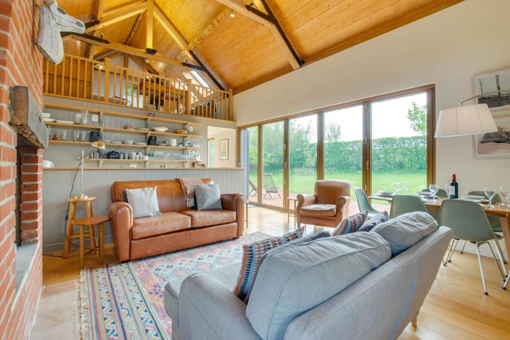 a living room with a couch and a table at 3 Bed in Debenham oc-thefol in Debenham
