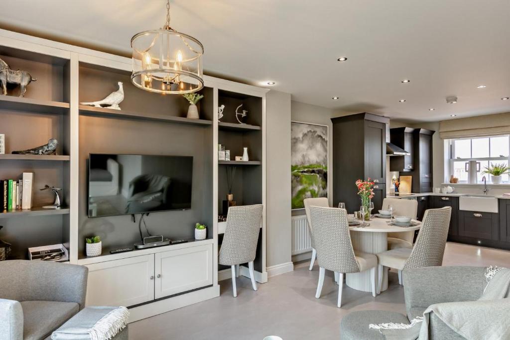a living room with a table and chairs and a tv at 3 Bed in Kirkby Stephen oc-c29217 in Kirkby Stephen