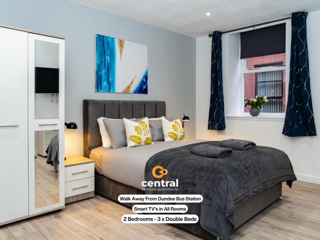 a bedroom with a bed and a window at The Bond by CENTRAL SERVICED APARTMENTS - 2 Bedrooms - 3 Double Beds - Walk Away From City Centre & Universities - Walk away from Bus & Train Station & Waterfront - Short & Long Stays Accomodated in Dundee