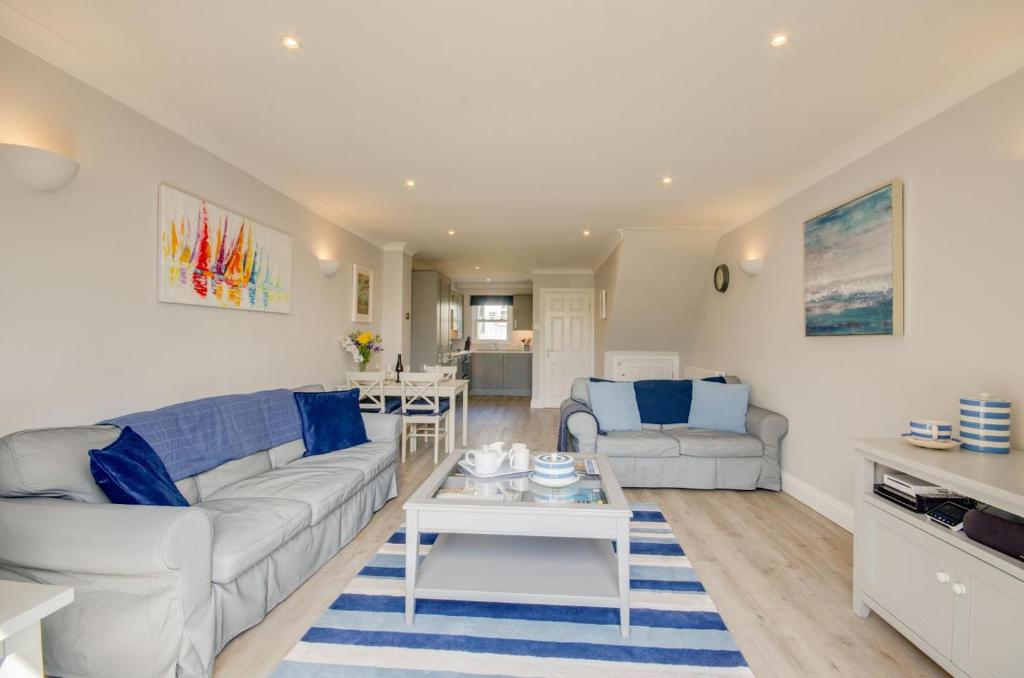 a living room with a couch and a table at 2 Bed in Fowey oc-p00857 in Fowey