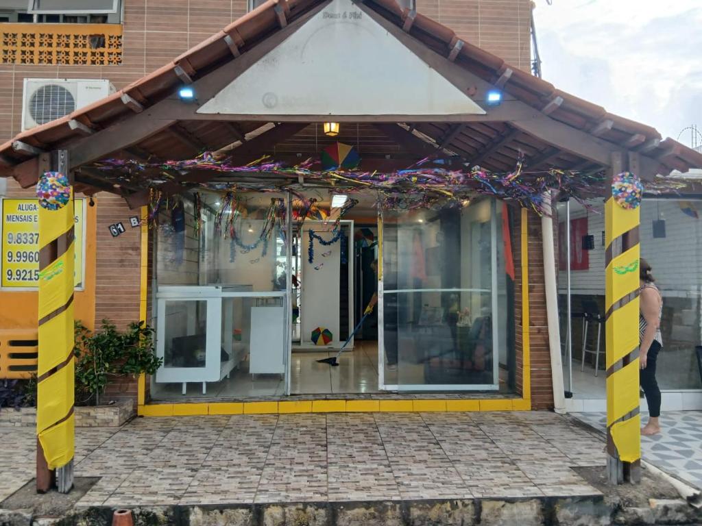 a front porch of a house with awning at Aconchego de Olinda in Olinda