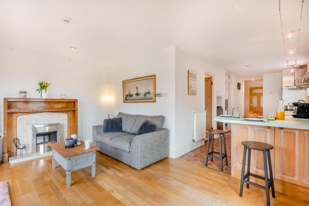 a living room with a couch and a fireplace at 2 Bed in Barnby oc-t28265 in North Cove