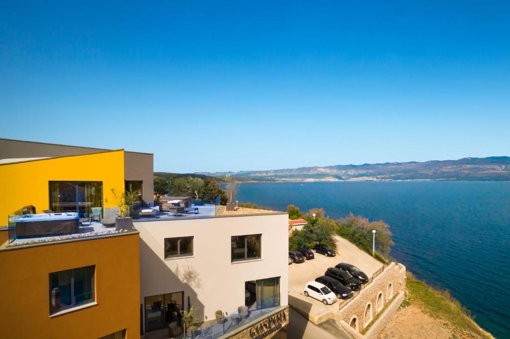 an aerial view of a building next to the water at Hotel Vinotel Gospoja in Vrbnik