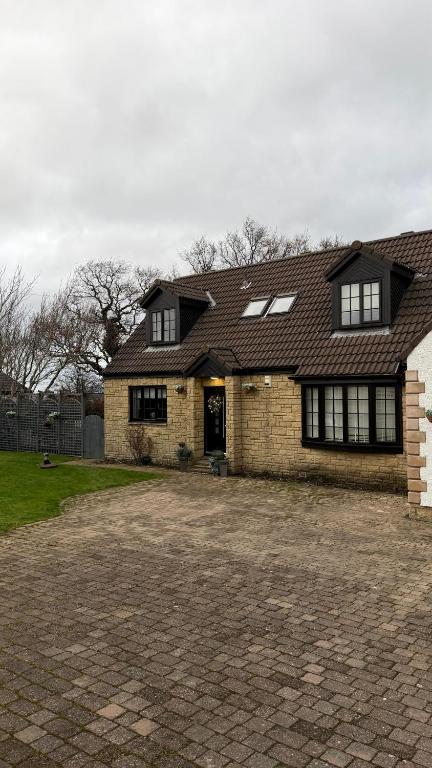 a large brick house with a brick driveway at Sea View House in Dalkeith