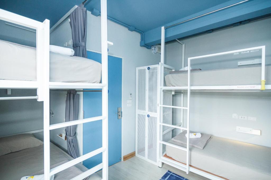 Voodi või voodid majutusasutuse The Moon Hostel Huahin toas