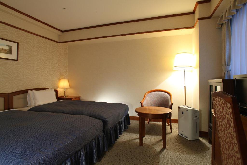 Postel nebo postele na pokoji v ubytování Hotel Viamare Kobe