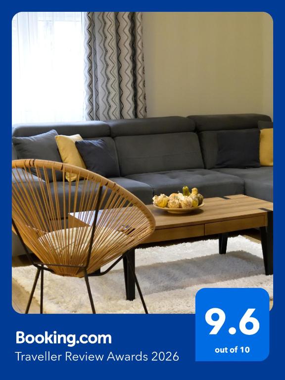 a living room with a couch and a coffee table at AeroVista Apartment in Surčin