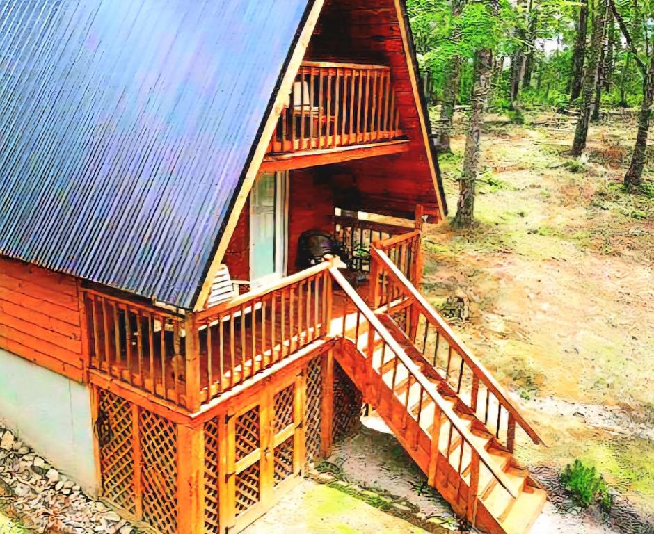 an aerial view of a cabin with a staircase leading to the porch at Forget Me Not Aframe-Cave Run in Wellington