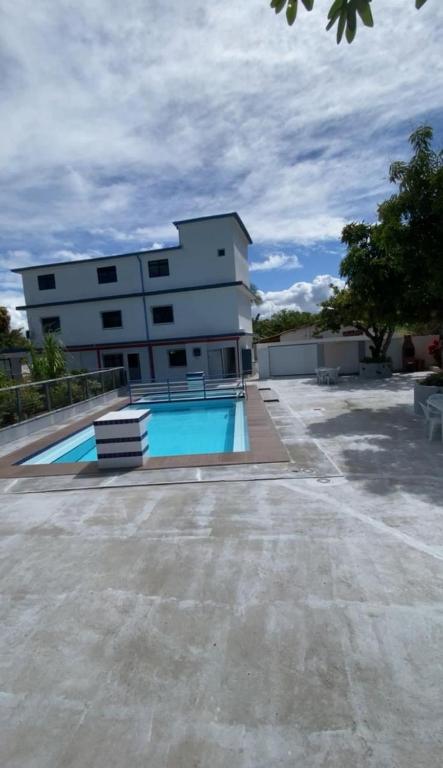 a building with a swimming pool in front of a building at PiscinasBar do Ramos in Conde