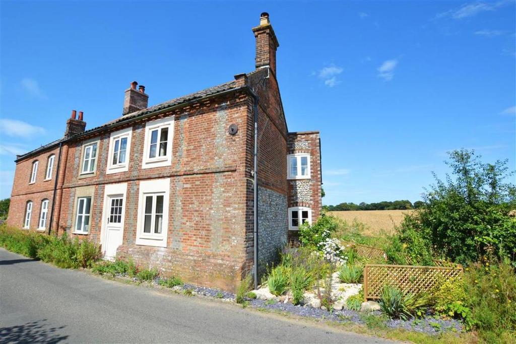 an old brick building on the side of a road at 2 Bed in Bodham oc-1660 in Bodham