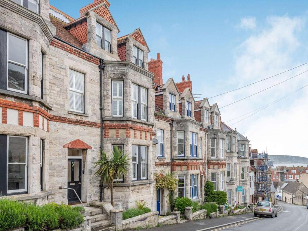 a row of old brick houses on a street at 5 Bed in Swanage oc-dc060 in Swanage