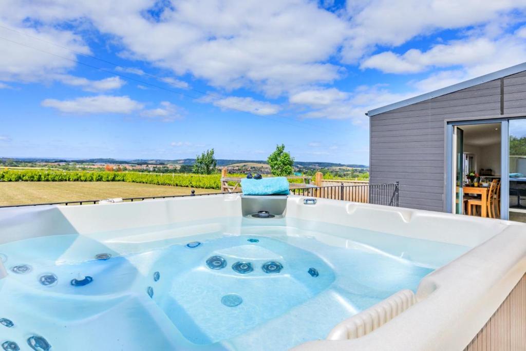 a jacuzzi tub in the backyard of a house at 2 Bed in Somerton oc-s32606 in Somerton