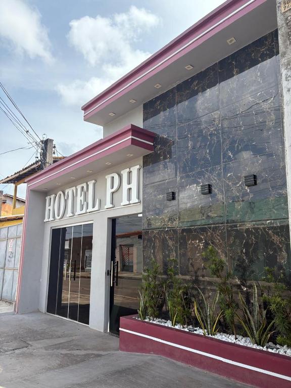 a hotel phil sign on the side of a building at Hotel ph in Barcarena