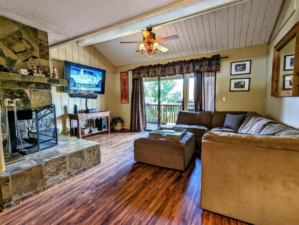 a living room with a couch and a fireplace at Snow Summit Townhouse Unit 69 in Big Bear Lake