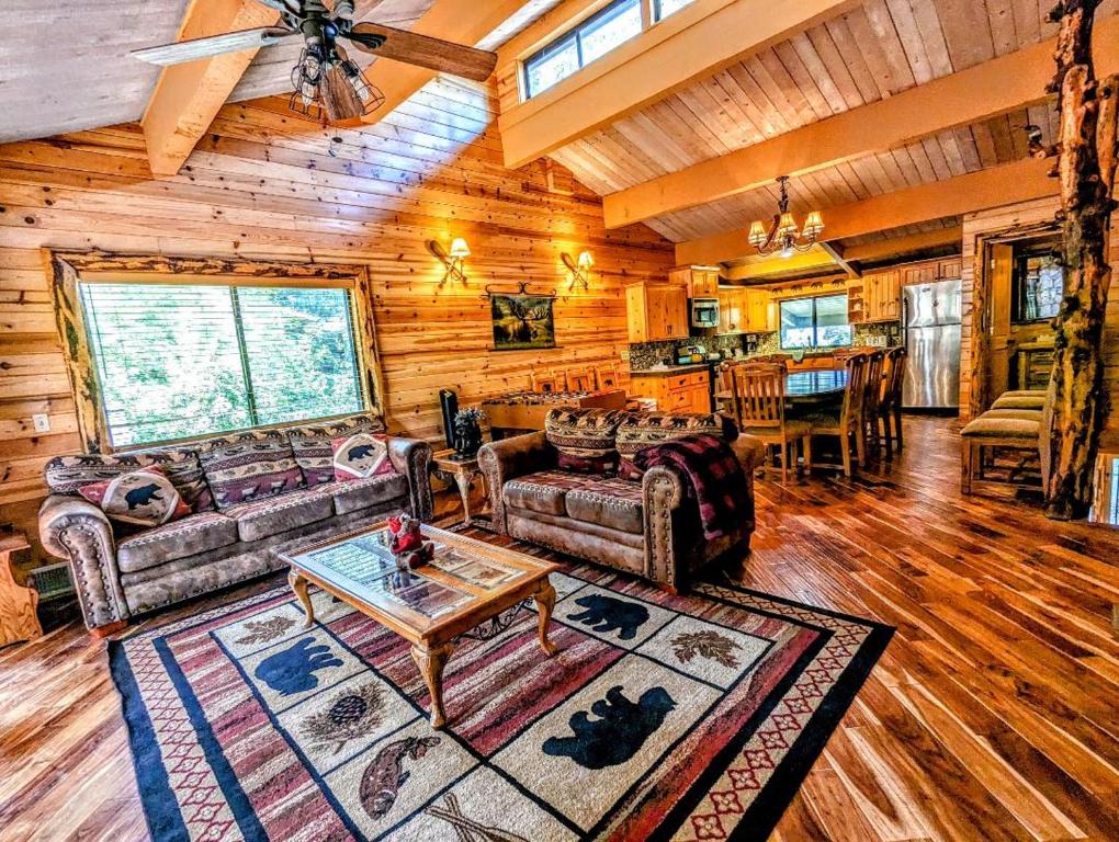 a living room with a couch and a table at Snow Summit Townhouse Unit 52 in Big Bear Lake