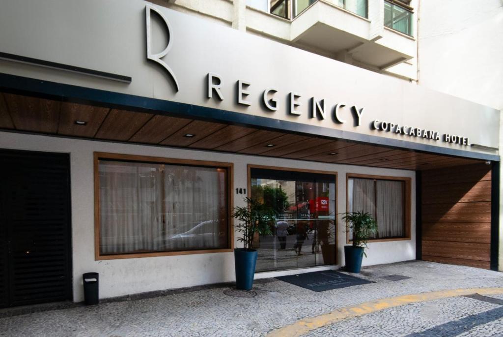 a building with a vacancy sign on the front of it at Regency Copacabana Hotel in Rio de Janeiro