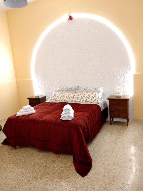 a bedroom with a large bed with an arch overhead at Bred breakfast D&D in Augusta