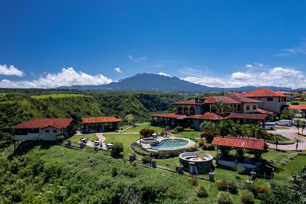 an aerial view of a house with a swimming pool at Hacienda Los Molinos Boutique Hotel & Villas in Boquete
