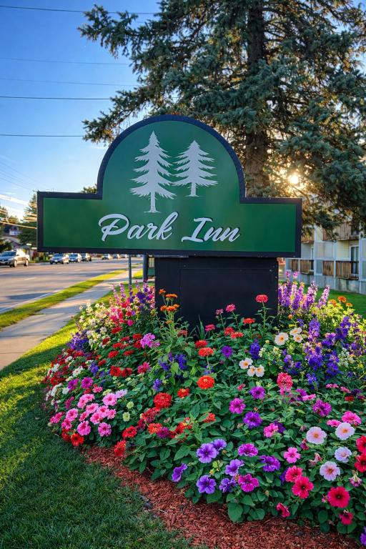 a sign for a park inn with flowers at Park Inn in Colchester