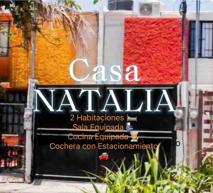 a sign on the side of a building at Casa Natalia Welcome in La Paz