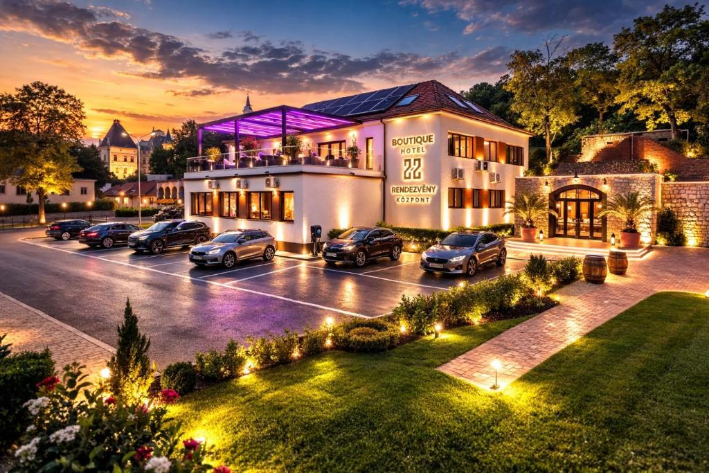 a building with cars parked in a parking lot at Boutique Hotel & Event Center in Budapest