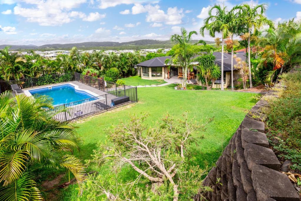an aerial view of a yard with a swimming pool and a house at The Hideaway in Yeppoon