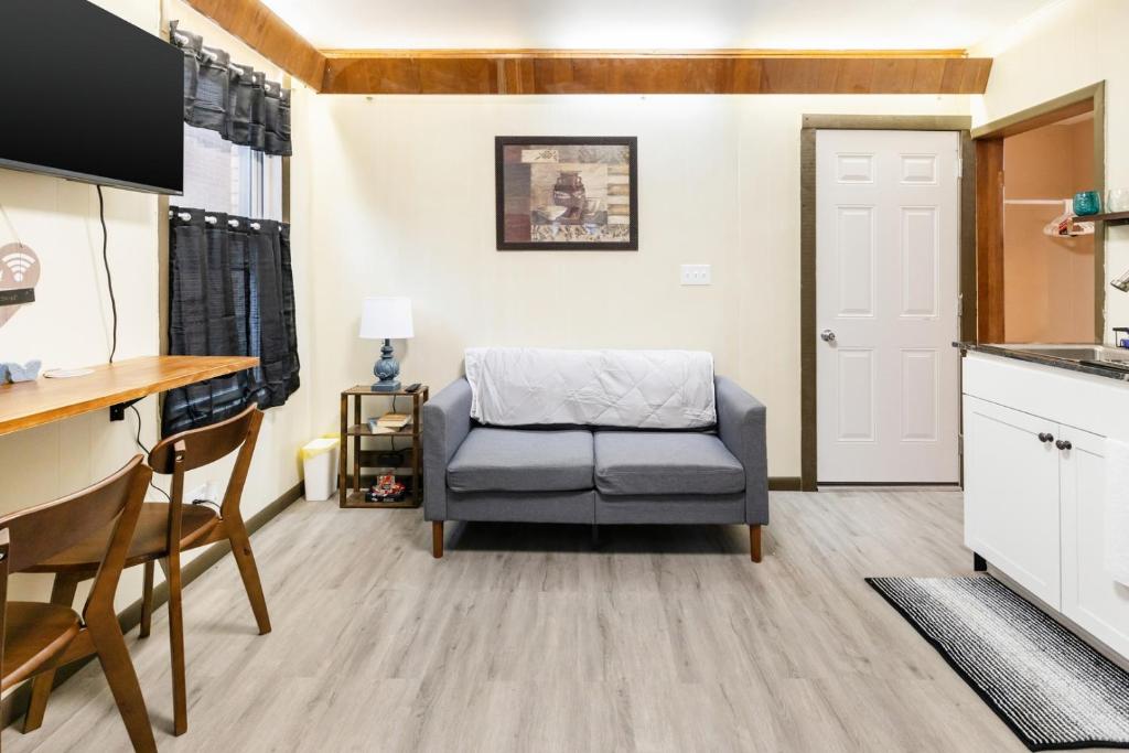 a living room with a chair and a table at Spacious 2BR Apt • Free Parking • Baden in Baden