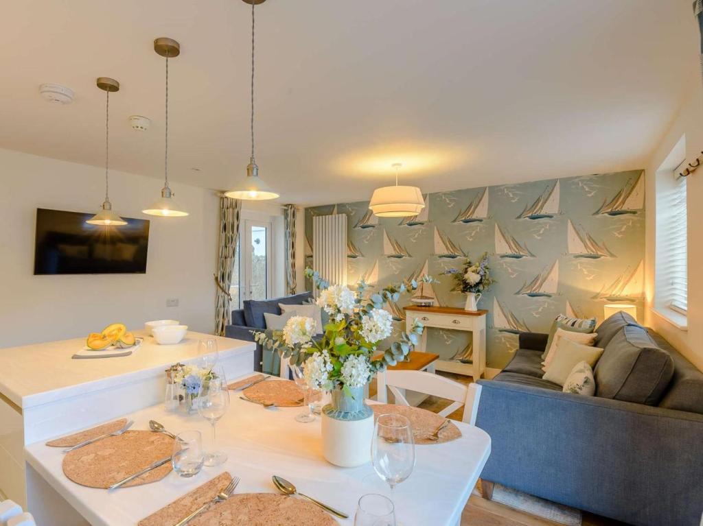 a living room with a couch and a table at 1 Bed in Hythe oc-89966 in Hythe