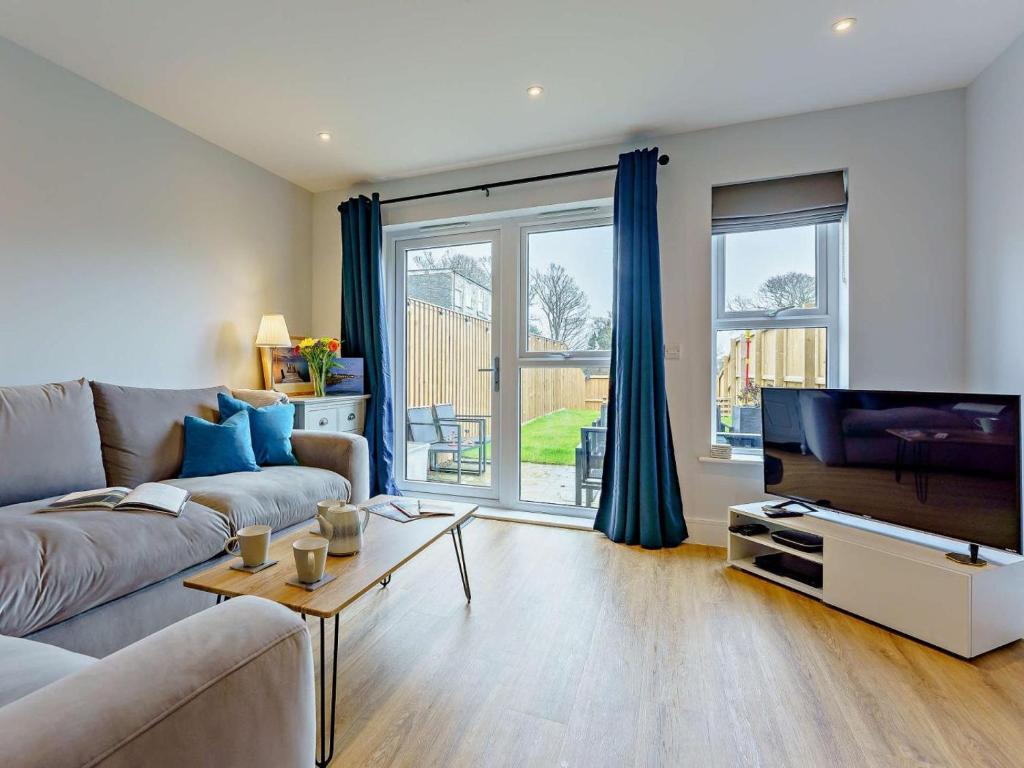 a living room with a couch and a tv at 2 Bed in Sandown oc-89291 in Sandown