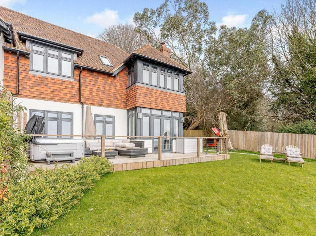 a house with a large backyard with a lawn at 3 Bed in Hythe oc-87167 in Hythe