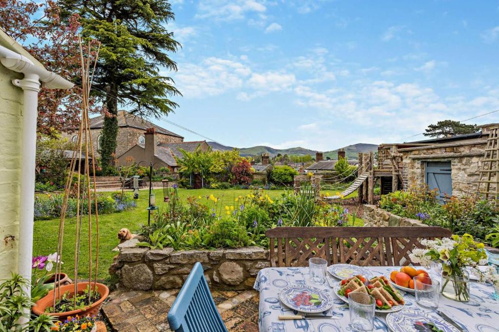 a table with food on it in a garden at 3 Bed in Ruthin oc-a29313 in Ruthin