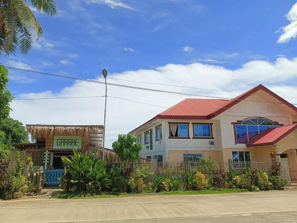 a house with a fence in front of it at Bert's Place in San Isidro
